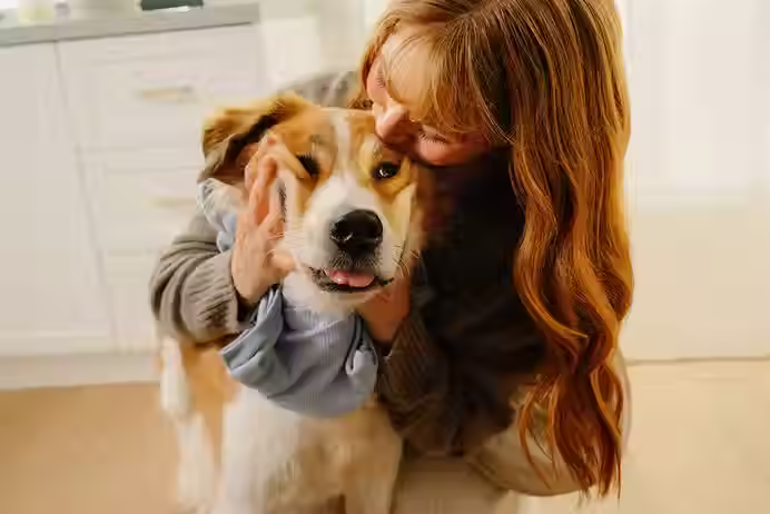 Dog and owner in a kitchen